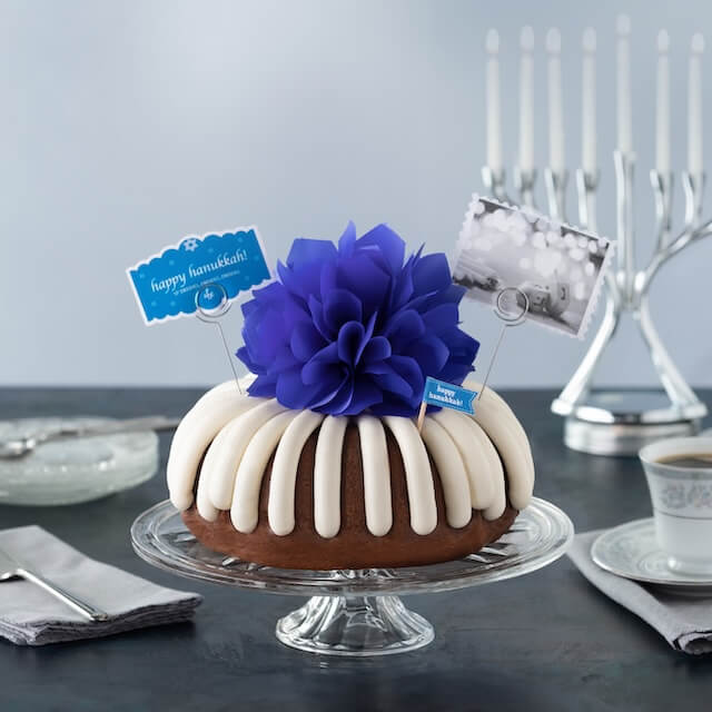 Festive Bundt Cake with a blue bow and happy hanukkah card