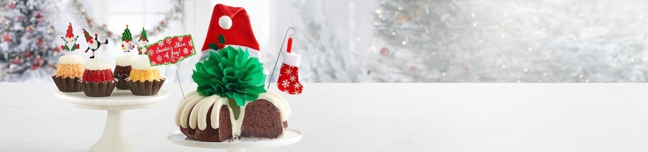 Holiday cake toppers featuring Santa Hat Bundt Cakes with mini stocking and Bundtinis with gnome decorations