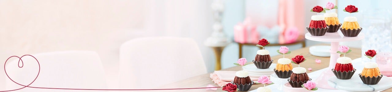 Featuring assortment of Bundtinis with heart decoration toppers