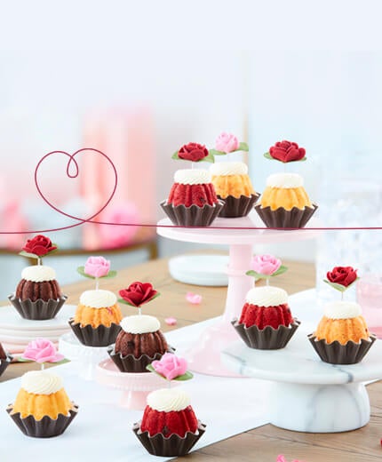 Featuring assortment of Bundtinis with heart decoration toppers