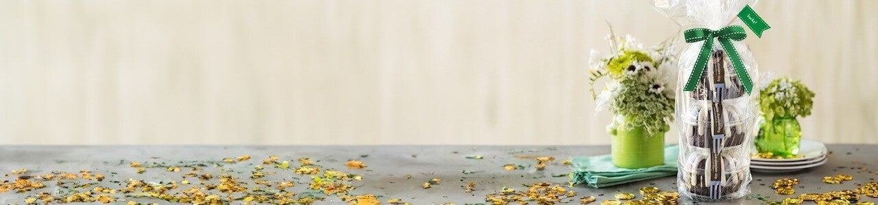 Triple Bundtlet Tower wrapped in cellophane and green ribbon