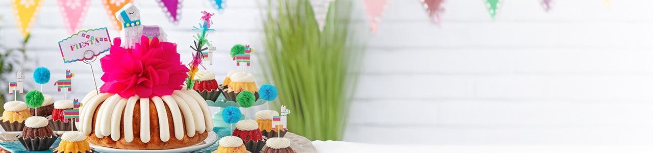 Let the Fiesta Begin Bundt Cake with Fiesta Bundtinis on a decorated table
