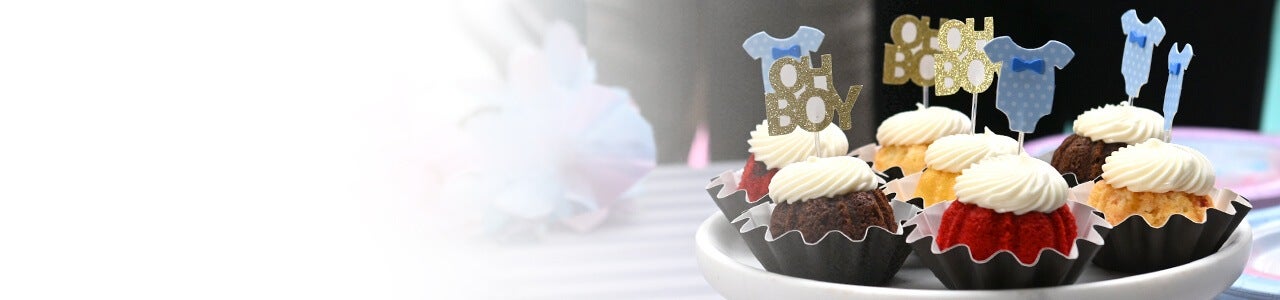 Bundtinis on a cake tray decorated with 