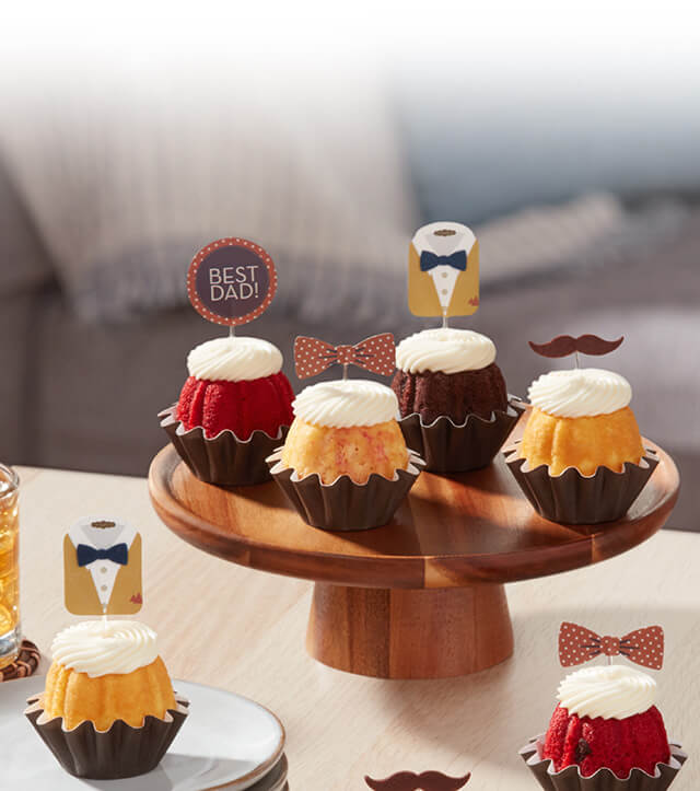 Coffee table featuring Best Dad Bundtinis.