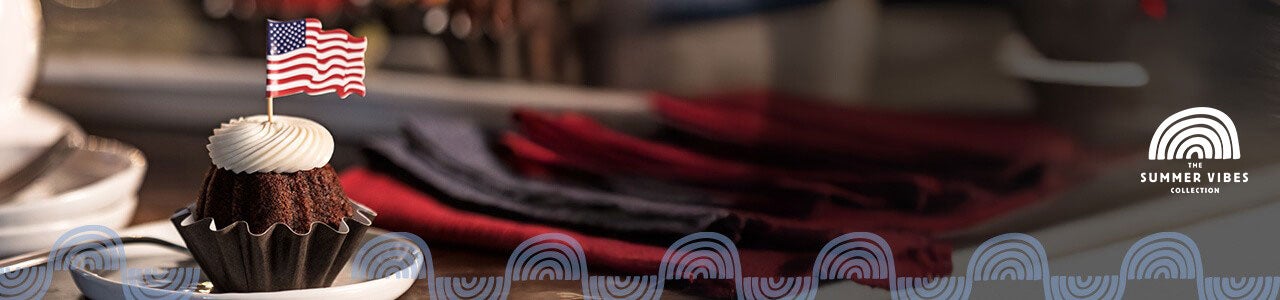 Bundtini with a paper waving flag bundtini topper on a festive holiday table