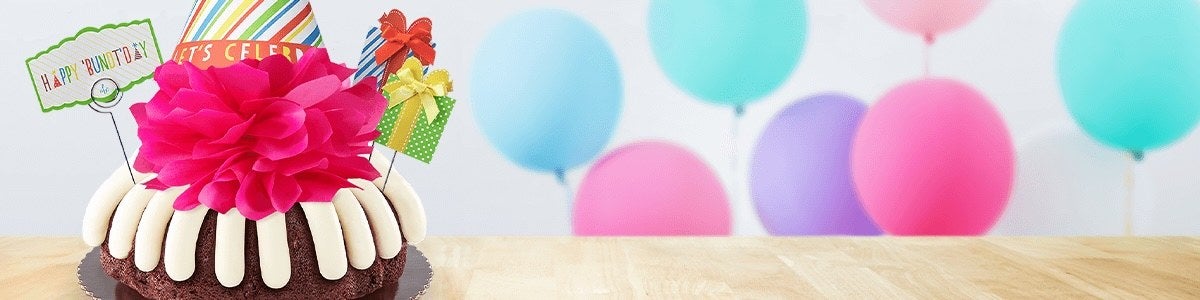 Lets Party Birthday Bundt Cake - with a purple bow on top