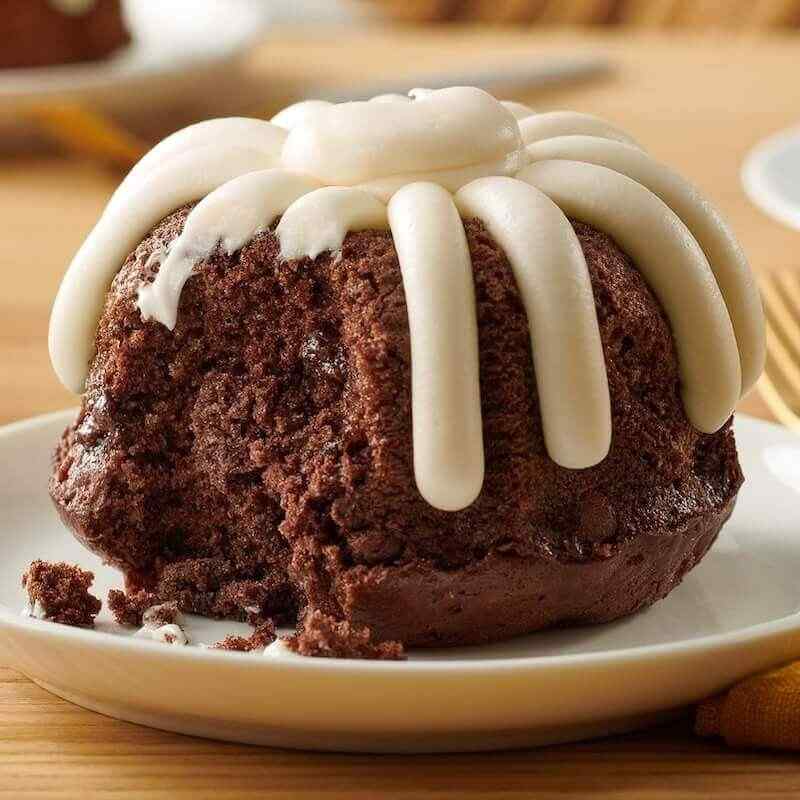 Individual Carrot Bundtlet showing the middle of the personalized sized cake and signature frosting on top - Shop Bundtlets & Towers