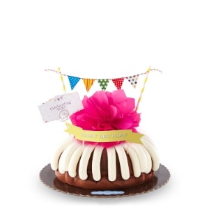10 inch Bundt cake with pink bow, message card, and banner