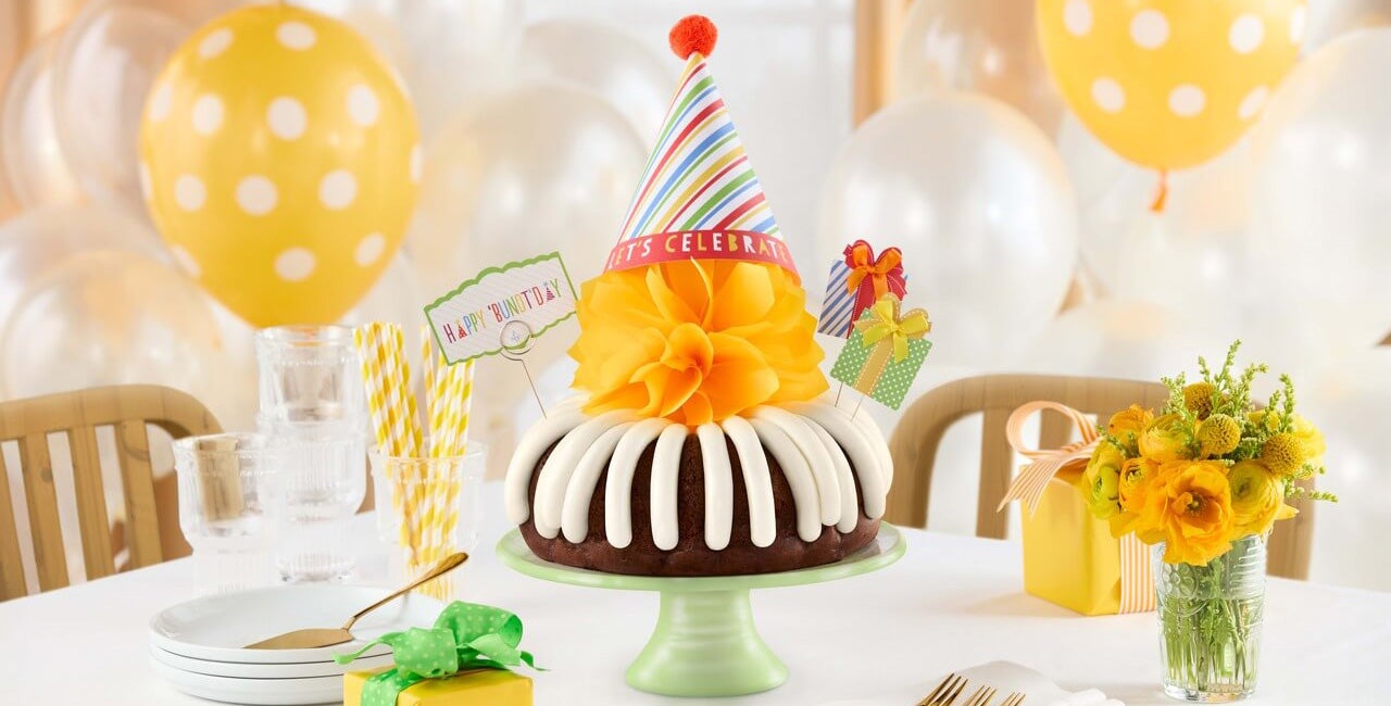 Happy Bundt Day Bundt Cake with a yellow bow, party hat- Shop Now