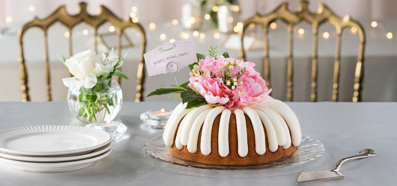 Bundt Cake with pink peony on a decorated table - Shop Now