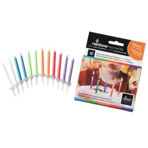 12 candles in various colors next to the packaging for the candles.