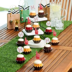 Mini bundt cakes topped with frosting with baseball and #1 foam finger toppers.