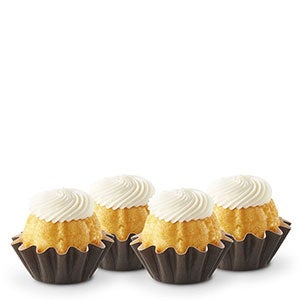 Four Lemon Bundtinis sitting in a row.