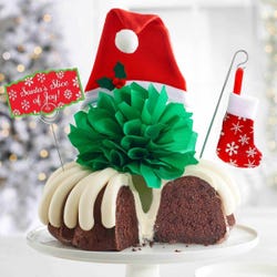 8" Bundt Cake with a green bow and Santa hat in the center