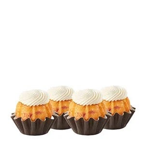 Four White Chocolate Raspberry Bundtinis sitting in a row.