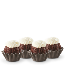 Chocolate Chocolate Chip flavored mini bundt cakes topped with a cream cheese frosting swirl.