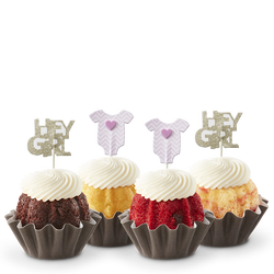 Mini cakes decorated with a pink baby onesie and Hey Girl toppers.