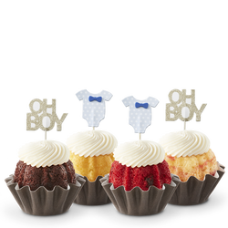 Mini cakes decorated with a blue baby onesie and Oh Boy toppers.