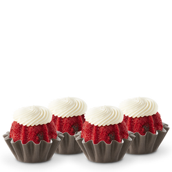 Red Velvet flavored mini bundt cakes topped with a cream cheese frosting swirl.